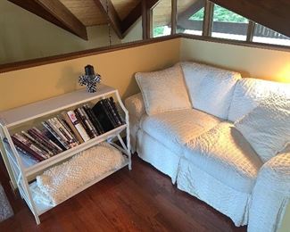 Cream love seat, bookcase