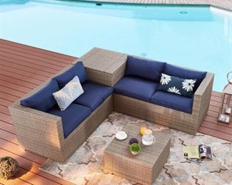 $699 New Patio Sectional 4 PC Set. Corner unit has storage. Navy and all weather wicker. Assembled
