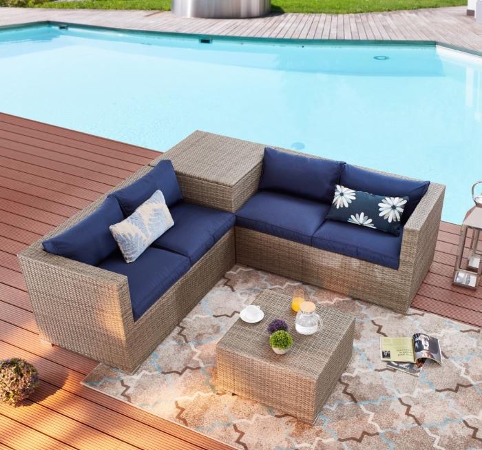 $699 New Patio Sectional 4 PC Set. Corner unit has storage. Navy and all weather wicker. Assembled