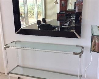 Mirror, 46 1/2" W x 34" H. Glass Top Table with Metal Frame, 51" W x 32" H x 14 1/2" D. 