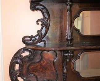 Marble Top Sideboard (Attributed to "Mitchell and Rammelsburg ") with mirrored top and Heavily Carved Fruits, Fish & Foliage.  In Pristine Condition Mahogany  Measures 97" tall, 72" wide and 26" deep 