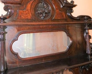 Marble Top Sideboard (Attributed to "Mitchell and Rammelsburg ") with mirrored top and Heavily Carved Fruits, Fish & Foliage.  In Pristine Condition Mahogany  Measures 97" tall, 72" wide and 26" deep 