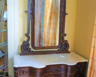 Mahogany Marble Top Dresser with Egg Carved Motif Mirror Frame.  Serpentine Front measures 100" tall, 50" wide and 26" deep