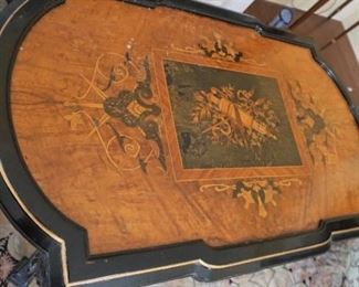 Renaissance Revival Ebonized and Gilded incised Center Table With Crown Motif
Measures 42” long, 26” deep and 31 tall
