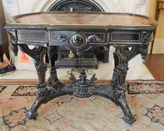 Renaissance Revival Ebonized and Gilded incised Center Table With Crown Motif  Attributed to Allen & Brothers Furniture Co. Philadelphia
Measures 42” long, 26” deep and 31 tall
