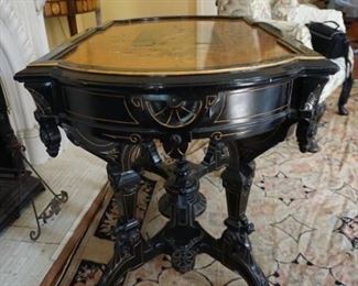 Renaissance Revival Ebonized and Gilded incised Center Table With Crown Motif
Measures 42” long, 26” deep and 31 tall
