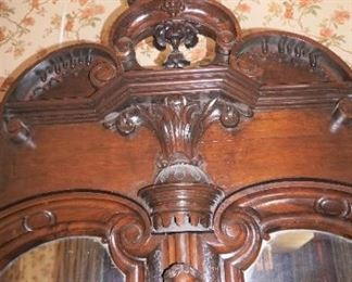 Monumental Heavily Carved Italian Baroque Mahogany Two Door Armoire with lower single drawer.  Solid Carved full body Italian Maiden, Open Pierced Carved Crown and Original Urn Finials. on Carved Feathered Feet  Measures 110" tall, 80" wide & 25" deep.