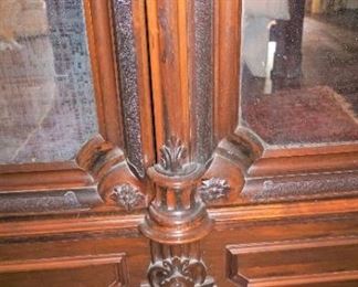 Monumental Heavily Carved Italian Baroque Mahogany Two Door Armoire with lower single drawer.  Solid Carved full body Italian Maiden, Open Pierced Carved Crown and Original Urn Finials. on Carved Feathered Feet  Measures 110" tall, 80" wide & 25" deep.