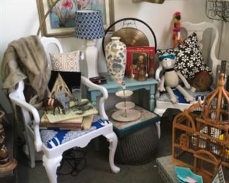 White armed chairs.  Arc floor lamp. 