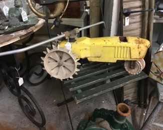Antique tractor sprinkler. 