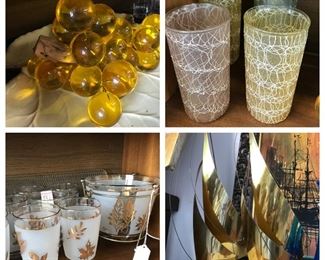 Tons of MCM glassware.   Brass boats and vintage glass grapes