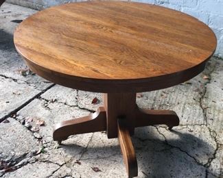 42” round oak pedestal table.  Great condition. 