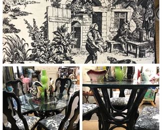 Glass top table and black chairs. 