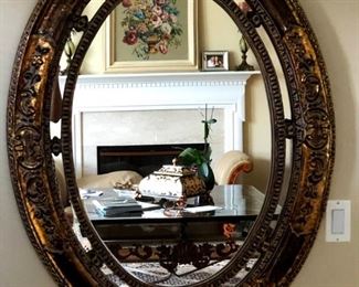 Beautiful oval gold accented wall mirror