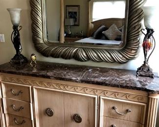 long marble topped dresser and huge gorgeous mirror are sure to stun