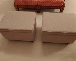 Set of upholstered ottomans with storage bins