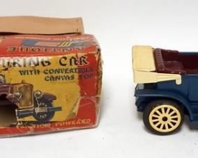 1054	VINTAGE TIN FRICTION TOURING CAR IN BOX, BOX HAS WEAR. 1 HUBCAP MISSING, CAR IS 10 1/2 IN LONG
