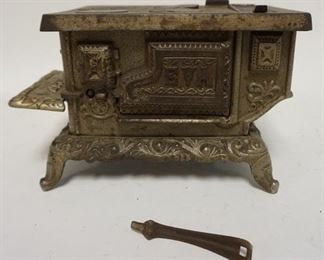 1058	ANTIQUE SALESMAN SAMPLE *EVA* MINIATURE CAST IRON STOVE KENTON BRAND. 9 IN WIDE X 4 3/4 IN DEEP AND 5 1/4 IN HIGH
