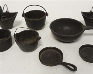 1061	ASSORTMENT OF CAST IRON MINIATURE POTS, ETC. FOR STOVES, 8 PIECES
