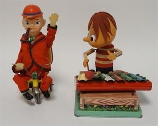 1198 2 BATTERY OPERATED TOYS MAN ON TRICYCLE & XYLOPHONE PLAYER, CHIPS MISSING ON XYLOPHONE PLAYER, TALLEST IS 12 IN
