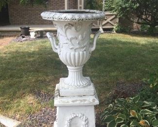 Monumental urn on stone base.  There are 2