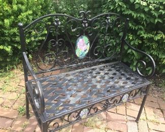 Metal bench with floral insert