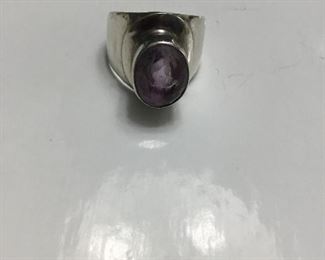 Sterling ring with amethyst colored set 