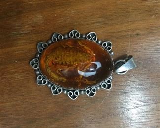 Amber and sterling silver pendant scorpion inclusion. 