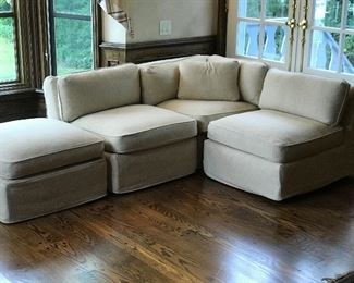 slip covered sections , slipper chairs, ottoman 