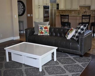 Bins under this game table are rolling bins