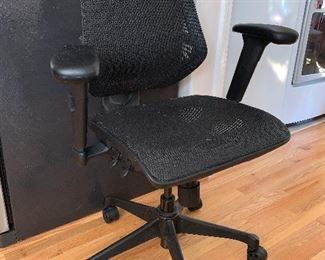 One of several rolling office chairs