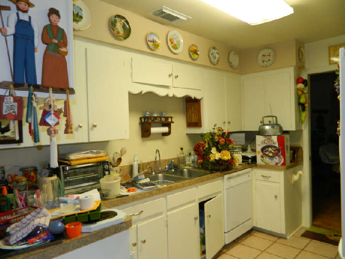 Kitchen dishes, pans, wall decor, wall plates, toaster oven, spices, cups, bowls more than you can see!