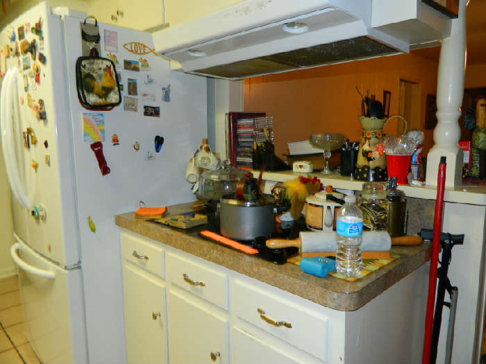 Kitchen dishes, pans, wall decor, wall plates, toaster oven, spices, cups, bowls more than you can see!