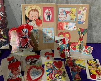 Antique Valentines in scrapbook, and lots of individual child Valentines