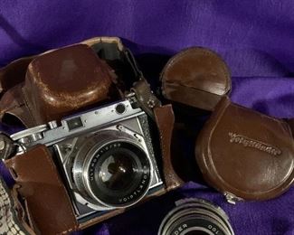 Antique 35mm camera with additional lenses all in Leather cases 