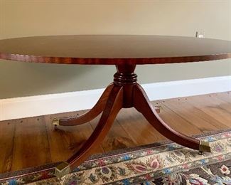Item 84:  Oval coffee table with brass casters by Southwood, Hickory, NC - 44.25"l x 30.5"w x 18.5"h:  $425