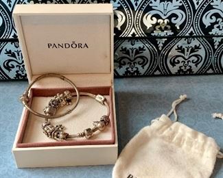 Item 110:  (2) Pandora bracelets - one with lots of charms:  $65