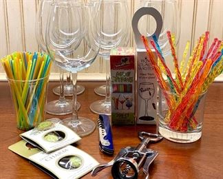 Item 306:  Lot of (7) wine glasses and assorted bar items:    $16