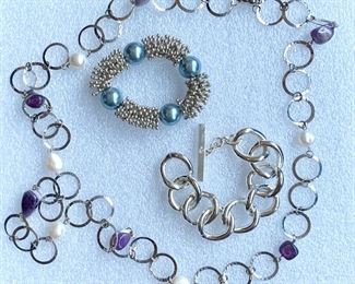 Two chunky bracelets and one necklace with pearls and purple stones: $25