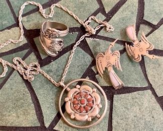 Love this lot of sterling jewelry - the pendant spins in the middle to reveal a turquoise design on the other side, pair of sterling bird earrings and a vintage sterling spoon ring: $85