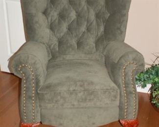 Wing backed green suede recliner, claw feet