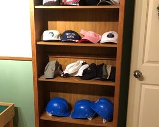 Bookcase and baseball hats!