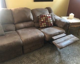 Upholstered sectional sofa with recliner and chaise.....