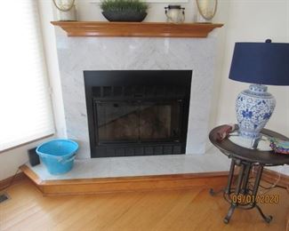 Gas fireplace insert; wood mantel