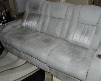 Double recliner with cup holders in the center of the couch.