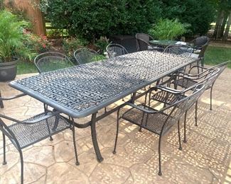 Table measures 9’ by 42” with 8 chairs