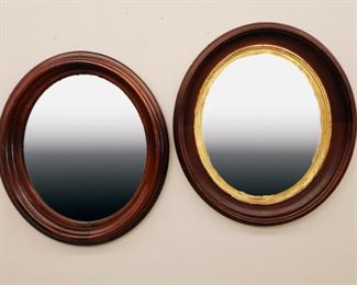 2 late 19th century large walnut oval frames. Older finish, mirrors are replacements. 18 x 21" and 19 x 22".