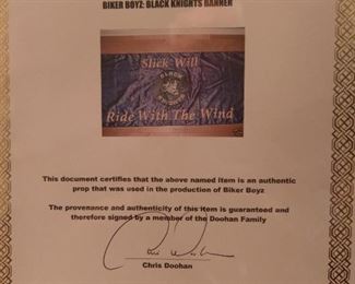 Letter of authenticity of banner used in movie and signed by cast.
