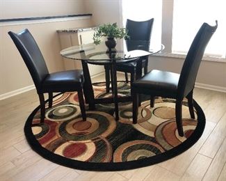 Glass topped table and 4 chairs (one not shown)