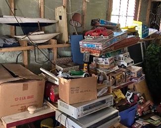 stacks of vintage toys everywhere in cellar and barn